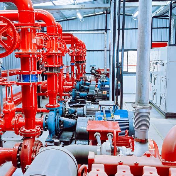 Fire pump house interior — electric fire pumps, control panels and header piping